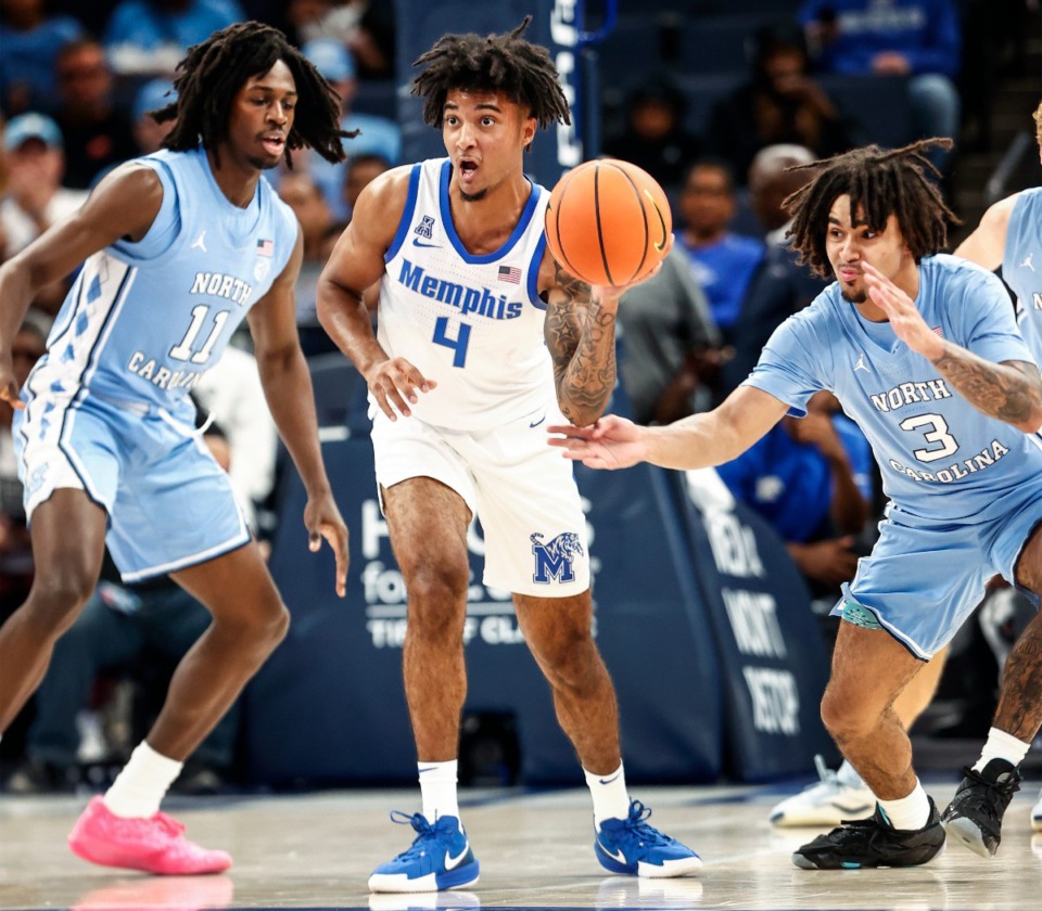 <strong>University of Memphis guard P.J. Haggerty (middle) makes a pass against North Carolina on Tuesday, Oct. 15, 2024.</strong> (Mark Weber/The Daily Memphian)