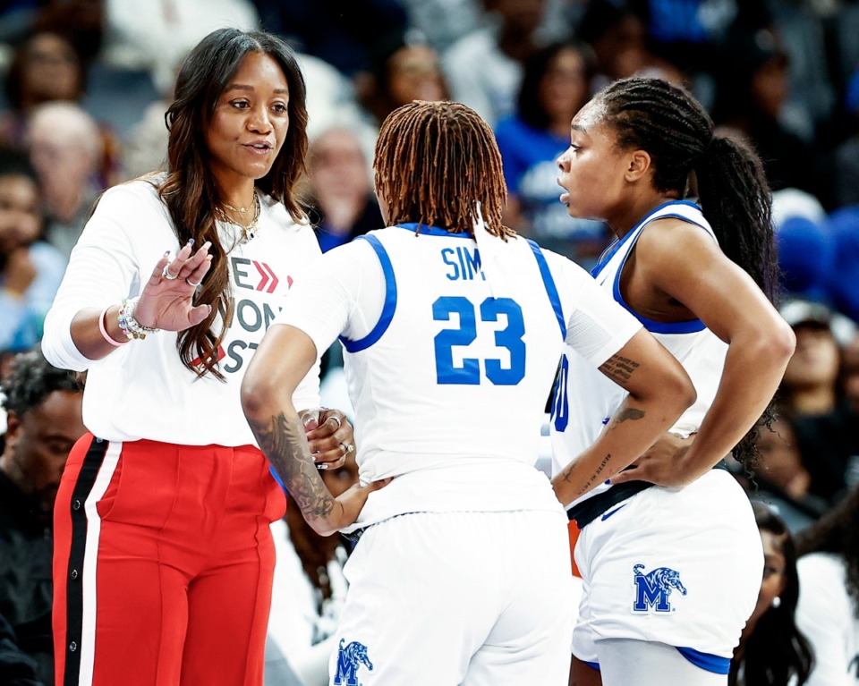 <strong>University of Memphis Tigers head coach Alex Simmons (left) gives instruction in the game against South Carolina on Tuesday, Oct. 15, 2024.</strong> (Mark Weber/The Daily Memphian)