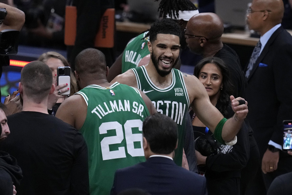 <strong>Boston Celtics forward Jayson Tatum celebrates with teammate forward Xavier Tillman (26) after a victory on May 27, 2024. The Celtics dominated from day one to the final buzzer last season.</strong> (Darron Cummings/AP FILE)