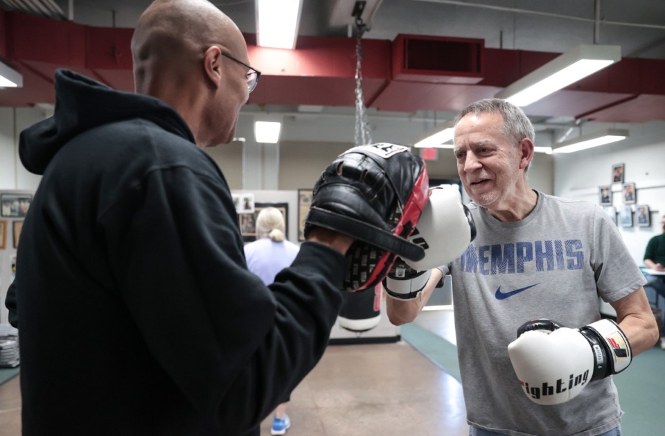 <strong>Jerry Rubio works with Reginald Foster during a boxing class for Memphians with Parkinson's hosted by the MPD Oct. 9, 2024.</strong> (Patrick Lantrip/The Daily Memphian)