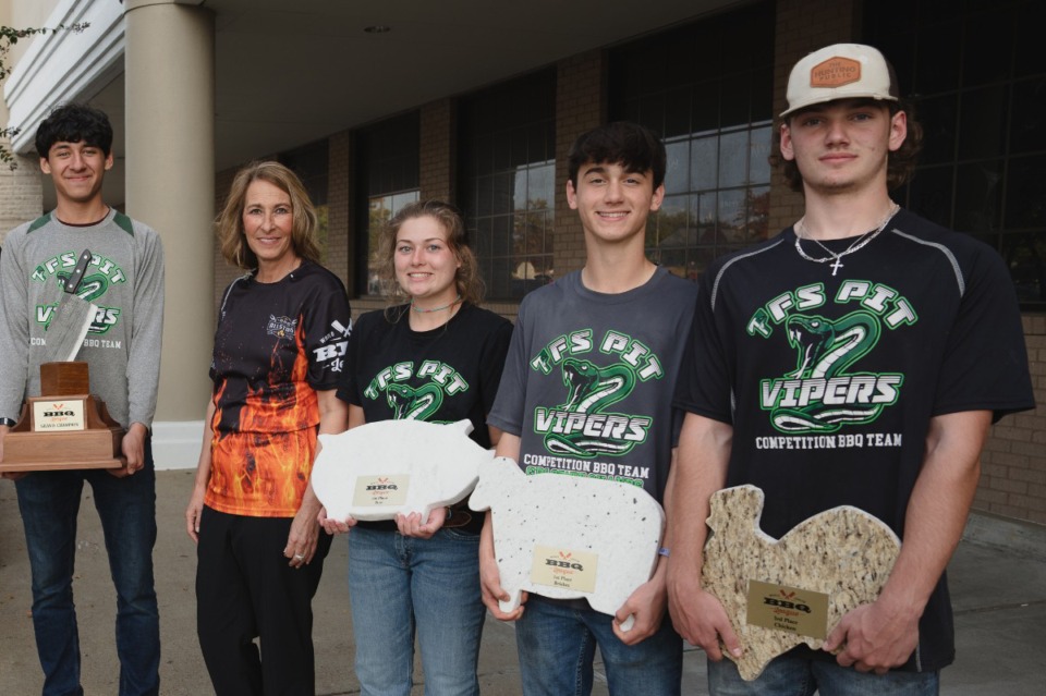 <strong>WJBL founder and legendary pitmaster Melissa Cookston (second from left) poses with a winning team at the 2023 World Junior BBQ League Championship.</strong>&nbsp;<strong>&ldquo;Not everybody can throw the perfect spiral or dunk a basketball,&rdquo; she said, &ldquo;but everybody can cook.&rdquo;</strong> (Courtesy World Junior BBQ League)