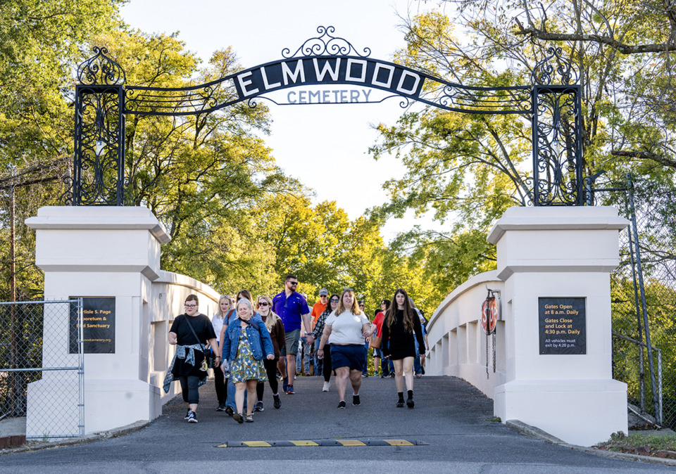 <strong>The tour group of Scoundrels and Scandals walk out of Elmwood Cemetery after finishing their tour Saturday, Oct. 19, 2024.</strong> (Greg Campbell/Special to The Daily Memphian)