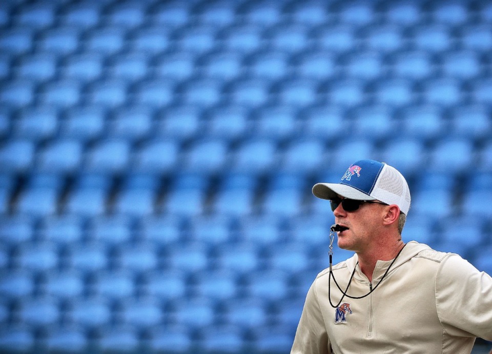 <strong>Head coach Mike Norvell runs his team through drills before the start of the Memphis Tigers&rsquo; annual scrimmage and fan fest at the Liberty Bowl Memorial Stadium on Aug. 10. The Tigers face Ole Miss on Aug. 31, in a nationally televised match at the Liberty Bowl.</strong> (Jim Weber/Daily Memphian)
