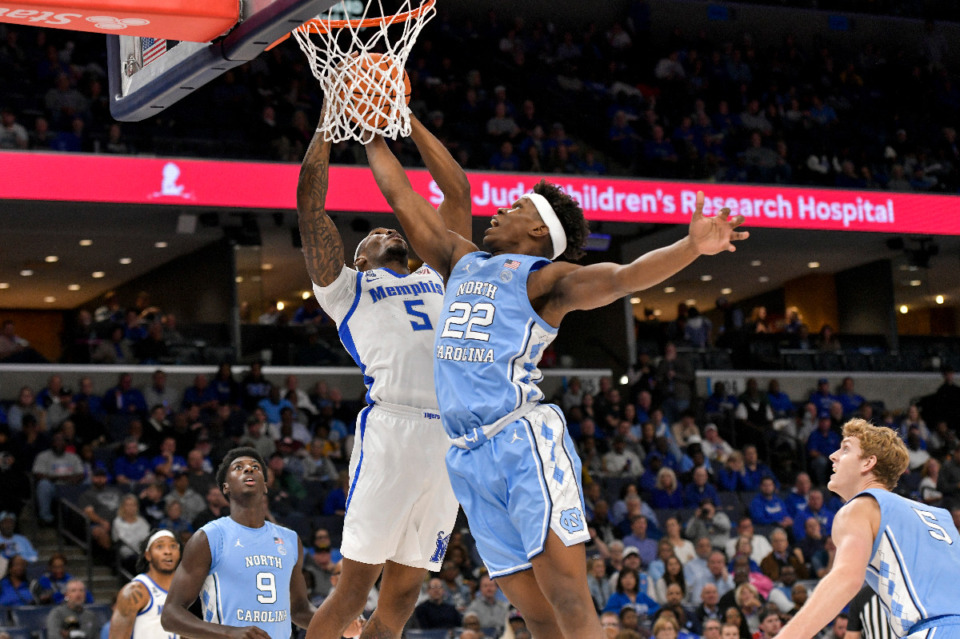 <strong>Memphis forward Tyreek Smith (5) shoots against North Carolina forward Ven-Allen Lubin (22) during the Hoops for St. Jude Tip Off Classic NCAA college basketball exhibition game Tuesday, Oct. 15, 2024, in Memphis, Tenn.</strong> (AP Photo/Brandon Dill)