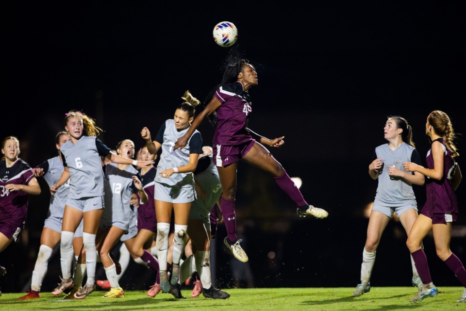 <strong>Collierville&rsquo;s Hilary Shikuku out jumps Houston defender McKlain Jones during a match</strong>. (Benjamin Naylor/The Daily Memphian)