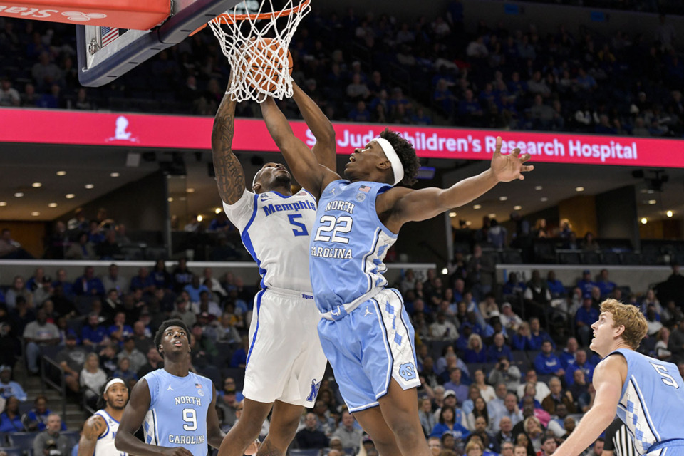 <strong>Memphis forward Tyreek Smith (5) shoots against North Carolina forward Ven-Allen Lubin (22) during the Hoops for St. Jude Tip Off Classic NCAA basketball exhibition game Oct. 15.</strong> (Brandon Dill/AP file)