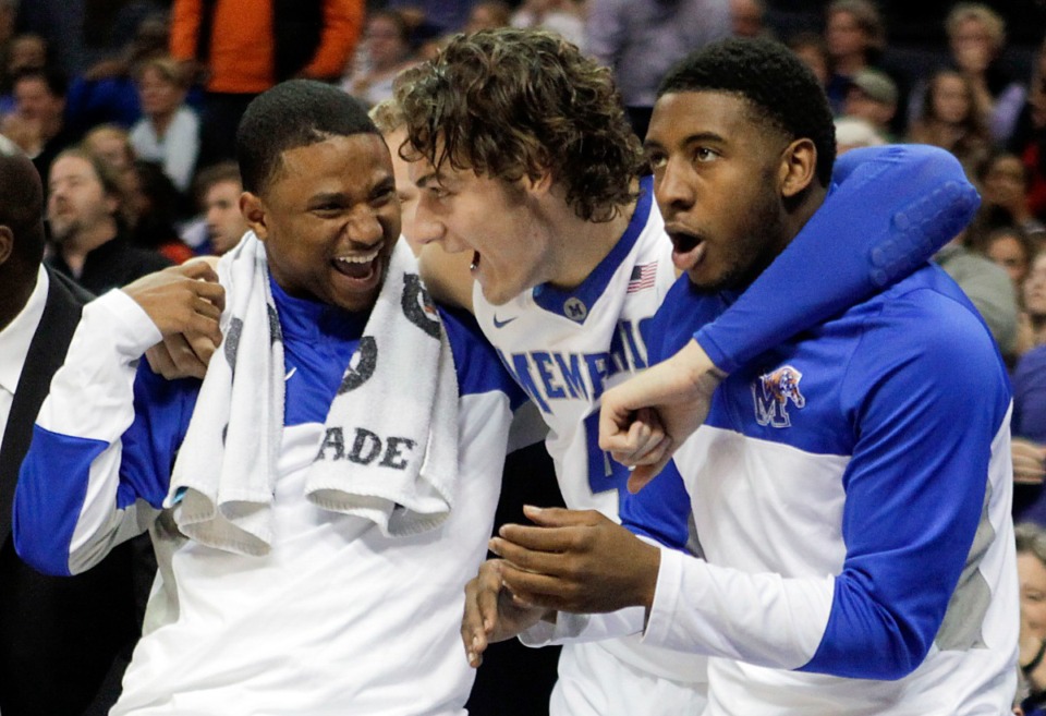 <strong>Trey Draper, left, celebrates with Memphis Tigers teammates Austin Nichols (middle) and Anthony Cole in 2013.</strong>&nbsp;(Lance Murphey/AP file)