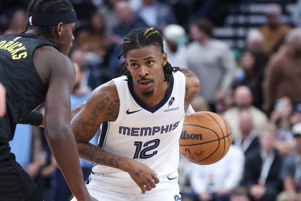 <strong>Memphis Grizzlies guard Ja Morant (12) charges against the Utah Jazz on Wednesday, Oct. 23, 2024, in Salt Lake City.</strong> (Rob Gray/AP)