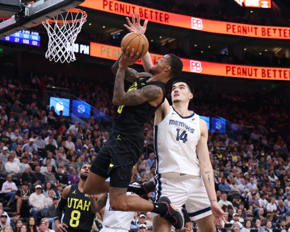 <strong>Utah Jazz forward John Collins (20) goes to the basket against Memphis Grizzlies center Zach Edey (14) during the second half of an NBA basketball game, Wednesday, Oct. 23, 2024, in Salt Lake City.</strong>&nbsp;(Rob Gray/AP)