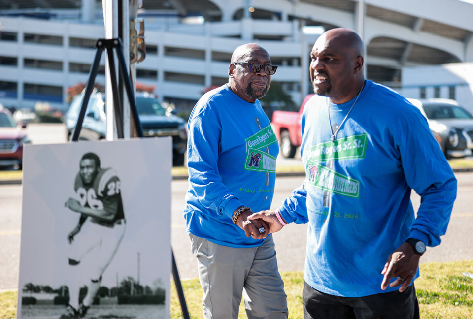 <strong>Former Memphis Tigers football player Glenn Rogers Sr. (left) is honored with a street named after him.</strong>&nbsp;<strong>His son, Glenn Rogers Jr. (right), introduced his father at Friday's ceremony. (</strong>Patrick Lantrip/The Daily Memphian)