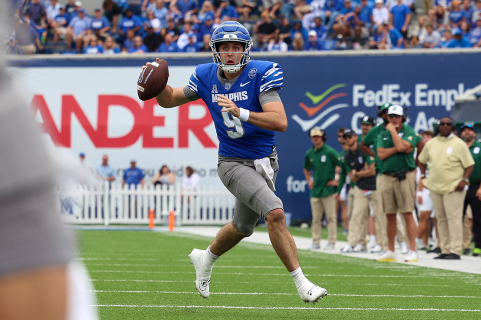 <strong>Memphis Tigers quarterback Seth Henigan, 9, looks to pass the ball against Charlotte during the second quarter Oct. 26 at Simmons Bank Liberty Stadium.</strong> (Wes Hale/Special to The Daily Memphian)