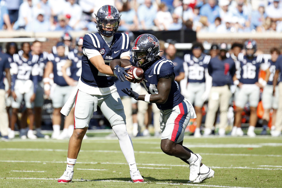 <strong>Mississippi quarterback Jaxson Dart (2) hands off the ball to running back Ulysses Bentley IV (24) during the first half of an NCAA college football game against Mississippi Oct. 26 in Oxford, Miss.</strong> (Sarah Warnock/AP file)