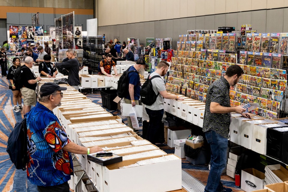 <strong>Attendees examine comic books during the Memphis Comic Expo at the Renasant Convention Center. The event continues through Sunday, Oct. 27.</strong> (Brad Vest/Special to The Daily Memphian)