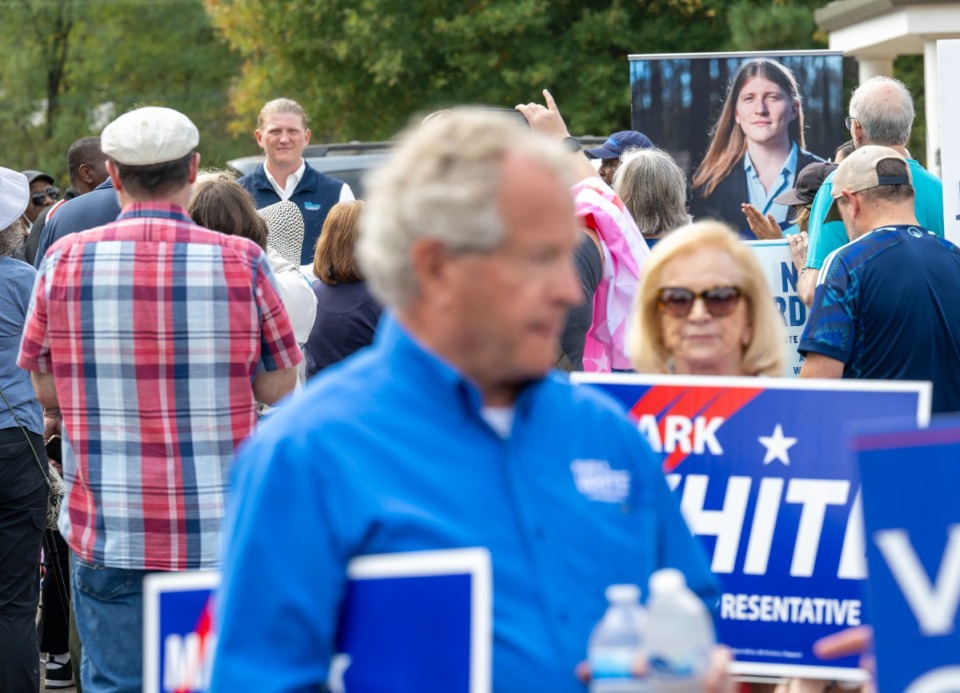 <strong>Noah Nordstrom (background), campaigns for the State House District 83 seat that is currently held by Mark White (foreground). Both talked to voters at New Bethel Baptist Church in Germantown Saturday morning, Oct. 26, 2024.</strong> (Greg Campbell/Special to The Daily Memphian)