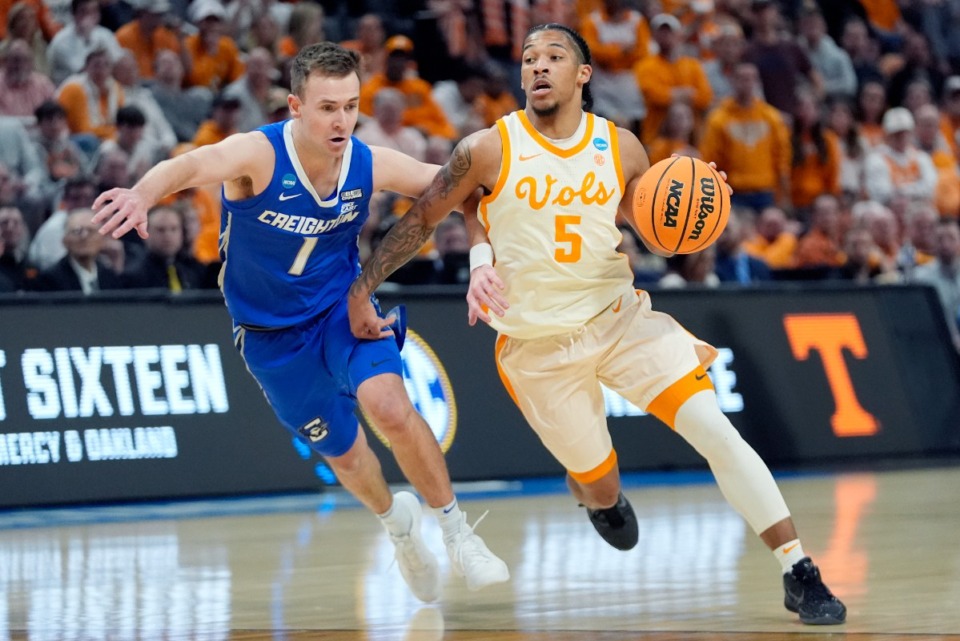 <strong>Tennessee guard Zakai Zeigler (5) drives as Creighton guard Steven Ashworth (1) defends during the first half of a Sweet 16 college basketball game in the NCAA Tournament, Friday, March 29, 2024, in Detroit.</strong> (Paul Sancya/AP File)