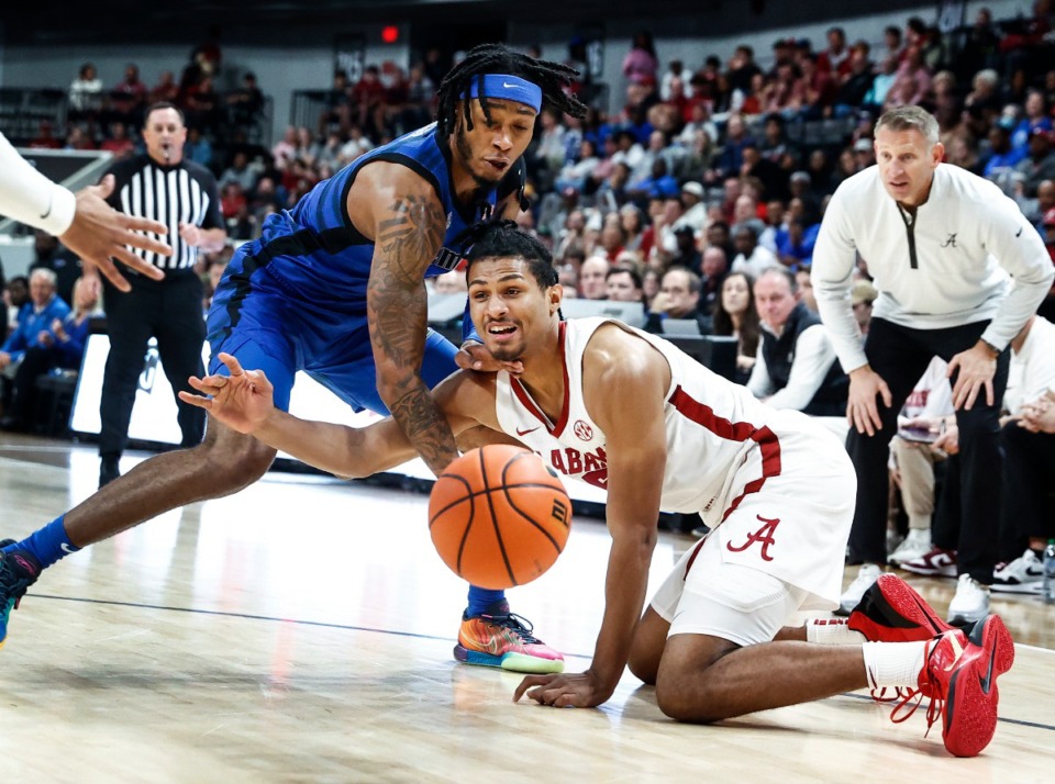 <strong>University of Memphis defender Colby Rogers (left) battles University of Alabama forward Jarin Stevenson (right) for a loose ball on Monday, Oct. 28, 2024.</strong> (Mark Weber/The Daily Memphian)