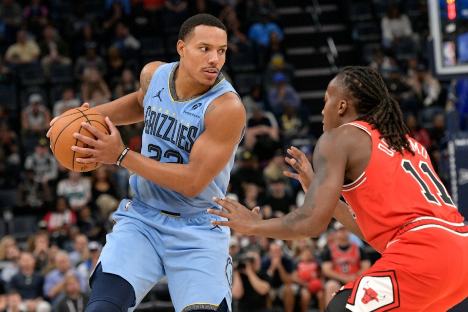 <strong>Memphis Grizzlies guard Desmond Bane, left, charges against Chicago Bulls guard Ayo Dosunmu (11) on Monday, Oct. 28, 2024.</strong>&nbsp;<strong>Bane led Memphis with 30 points.</strong> (Brandon Dill/AP)