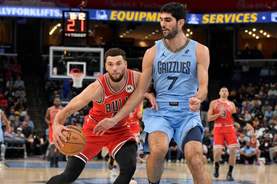 <strong>Chicago Bulls guard Zach LaVine handles the ball against Memphis Grizzlies forward Santi Aldama (7) in the first half of an NBA basketball game Monday, Oct. 28, 2024, in Memphis, Tenn.</strong> (AP Photo/Brandon Dill)