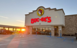 <strong>The sun rises beyond the 120 gasoline pumps outside a Buc-ee&rsquo;s store early April 4 in Johnstown, Colo.</strong> (David Zalubowski/AP file)