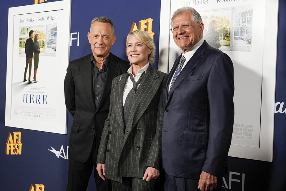 <strong>Tom Hanks, from left, Robin Wright, and Robert Zemeckis arrive at the AFI Fest premiere of "Here" on Friday, Oct. 25, 2024, at TCL Chinese Theatre in Los Angeles.</strong> (Chris Pizzello/AP Photo)