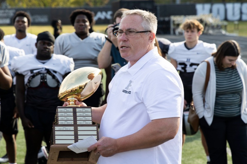 <strong>Germantown Mayor Mike Palazzolo shows off the new &ldquo;Mayor&rsquo;s Trophy,&rdquo; that will be awarded to the winner of the Houston vs. Colliervile football game.</strong> (Brad Vest/Special to The Daily Memphian)