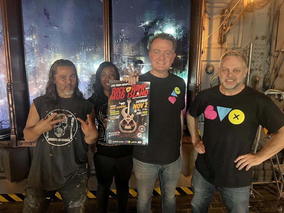 <strong>The Baron Von Opperbean team (from left to right; Chief Visionary Officer Christopher Reyes, Chief of Games and Technology Kathryn Hicks, Chief Communications Officer Marvin Stockwell, Chief Executive Officer Reuben Brunson) hold up a poster for the Rock-n-Romp event Nov. 2, 2024, in front of Platform 34.</strong> (Stevie Paige/The Daily Memphian)