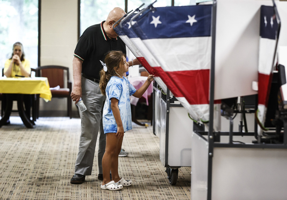 <strong>Memphis-Shelby County Schools will be closed for Election Day. Madeline West, helped her grandfather, Terrance Dolman, cast his at ballot at Second Baptist Church on Thursday, August&nbsp; 1.</strong> (Mark Weber/The Daily Memphian file)