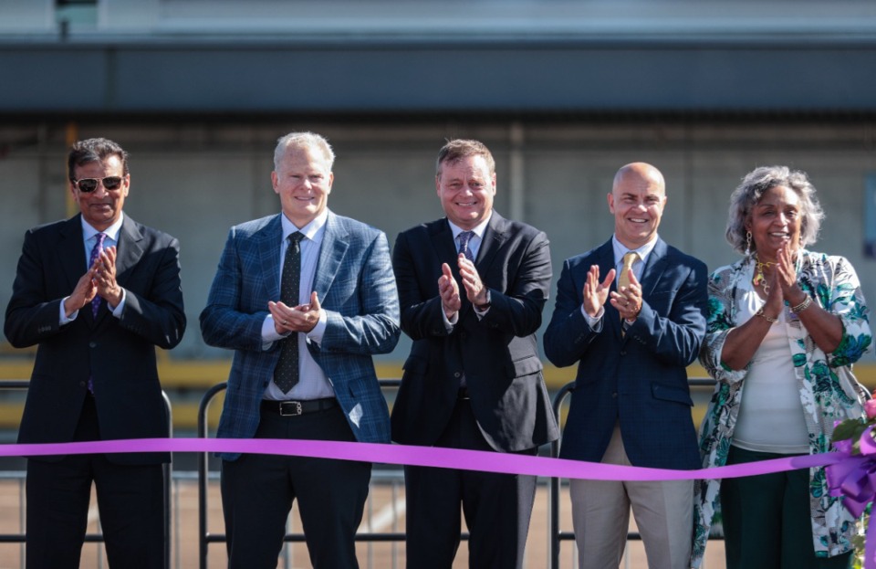 <strong>Richard Smith and other executives get ready to cut the ribbon on FedEx's new sorting facility at the Memphis International Airport Oct. 30, 2024.</strong> (Patrick Lantrip/The Daily Memphian)