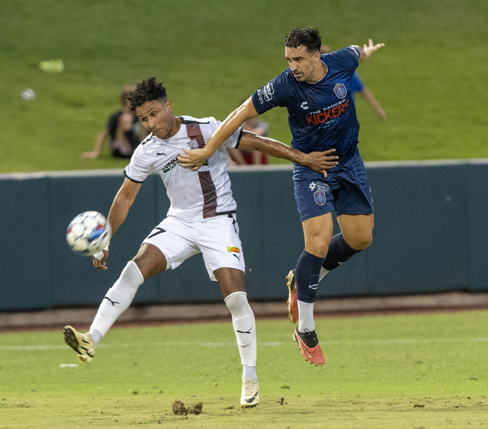 <strong>Memphis 901 FC's Lucas Henrique Turci, right, battles with San Antonio's Juan Agudelo for control of the ball in their matchup at AutoZone Park, Saturday, July 27, 2024. Turci scored the third and final goal in the win over New Mexico securing a top-four finish and the home match that comes with it.</strong> (Greg Campbell/Special to The Daily Memphian file)