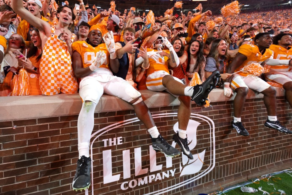 <strong>Tennessee tight end Titus Rohrer (89) and tight end Ethan Davis (0) celebrate with fans after UT&rsquo;s big win against rival Alabama on Saturday, Oct. 19, 2024, in Knoxville.</strong> (Wade Payne/AP file)