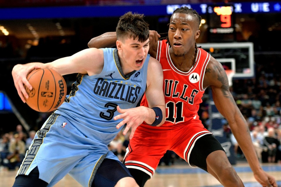 <strong>Memphis Grizzlies forward Jake LaRavia (3) drives against Chicago Bulls guard Ayo Dosunmu (11) in the second half of an NBA basketball game Monday, Oct. 28, 2024, in Memphis, Tenn.</strong> (AP Photo/Brandon Dill)