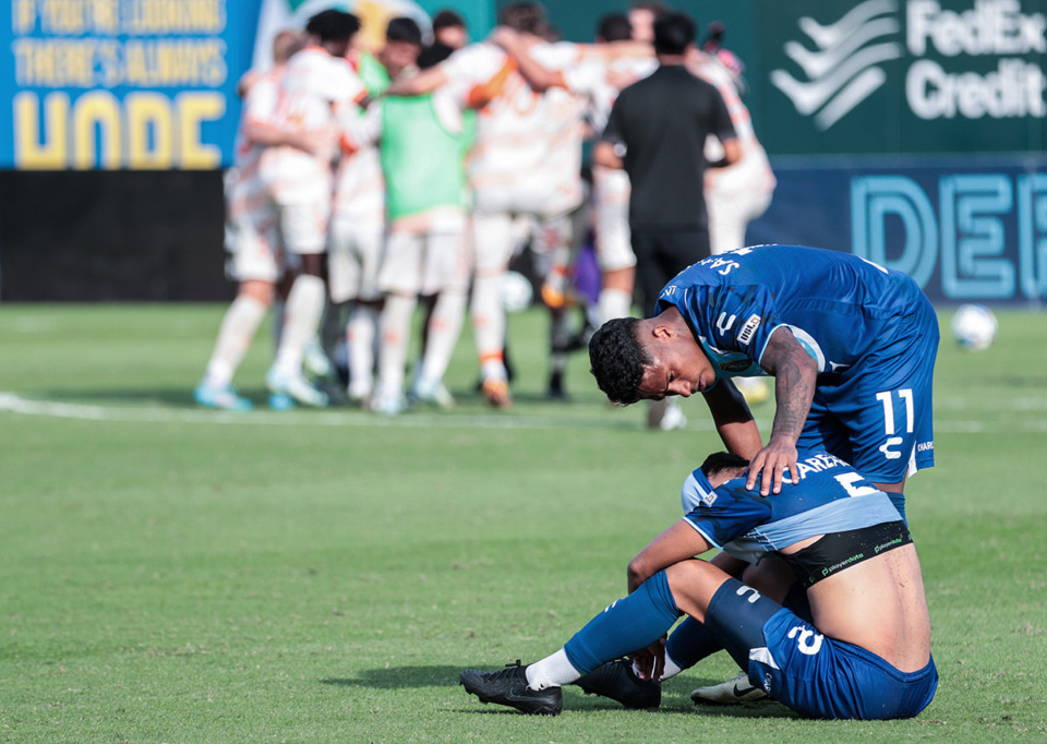 <strong>Memphis 901 FC forward Marlon Santos (11) comforts teammate Samuel Careaga (5) after a season-ending loss to Orange County FC Nov. 2.</strong> (Patrick Lantrip/The Daily Memphian)