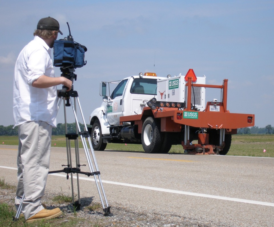 <strong>A cameraman tapes a vibe truck moving along Arkansas 140 Tuesday, May 16, 2006, to measure sediment in the area for evidence of past earthquakes in the New Madrid Seismic Zone near Lepanto, Ark</strong>. (AP Photo/The Jonesboro Sun, Michael Wilkey)