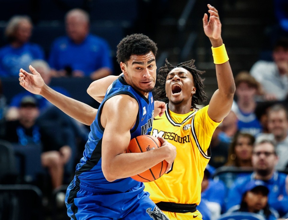 <strong>University of Memphis forward Nicholas Jourdain (left) grabs a rebound in front of University of Missouri defender Anthony Robinson II (right) on Monday, Nov. 4, 2024.</strong> (Mark Weber/The Daily Memphian)