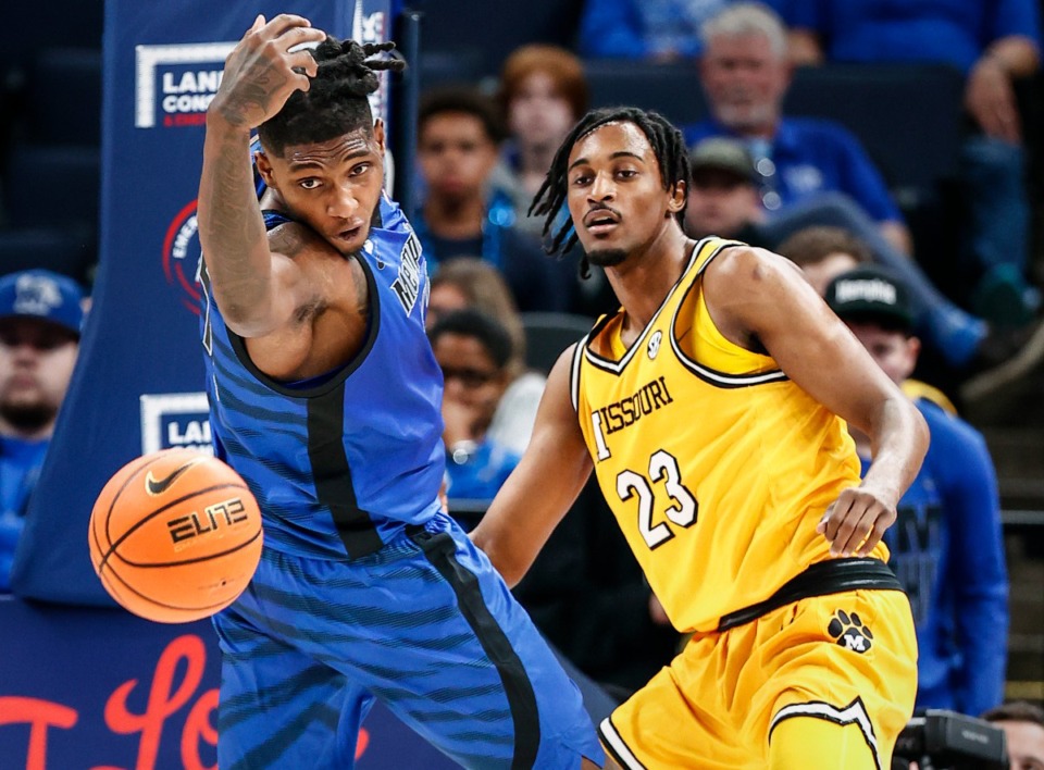 <strong>University of Memphis center Dain Dainja (left) loses control of a rebound in front of University of Missouri defender Aidan Shaw (right) don Monday, November 4, 2024.</strong> (Mark Weber/The Daily Memphian)