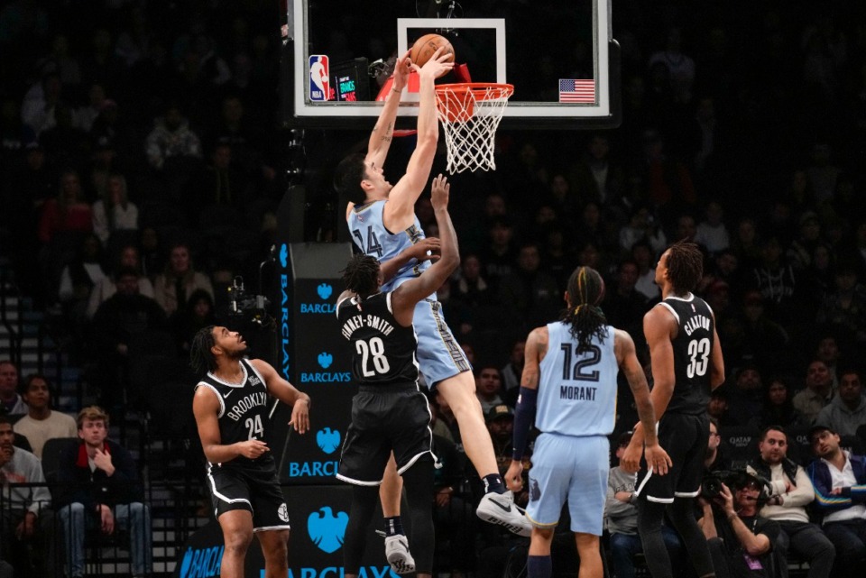 <strong>Memphis Grizzlies' Zach Edey, top, dunks the ball against the Brooklyn Nets on Monday, Nov. 4, 2024, in New York.</strong> (Seth Wenig/AP)