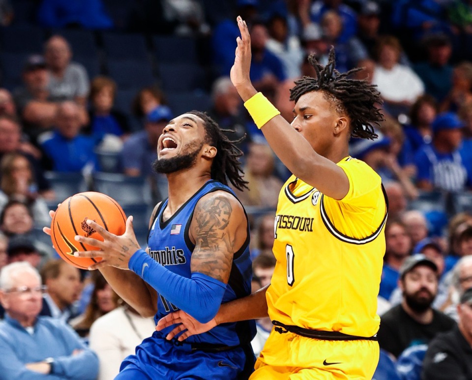 <strong>Memphis guard Tyrese Hunter (left) helped inspire his team to play out of a double-digit halftime deficit against Mizzou.</strong>&nbsp;(Mark Weber/The Daily Memphian)