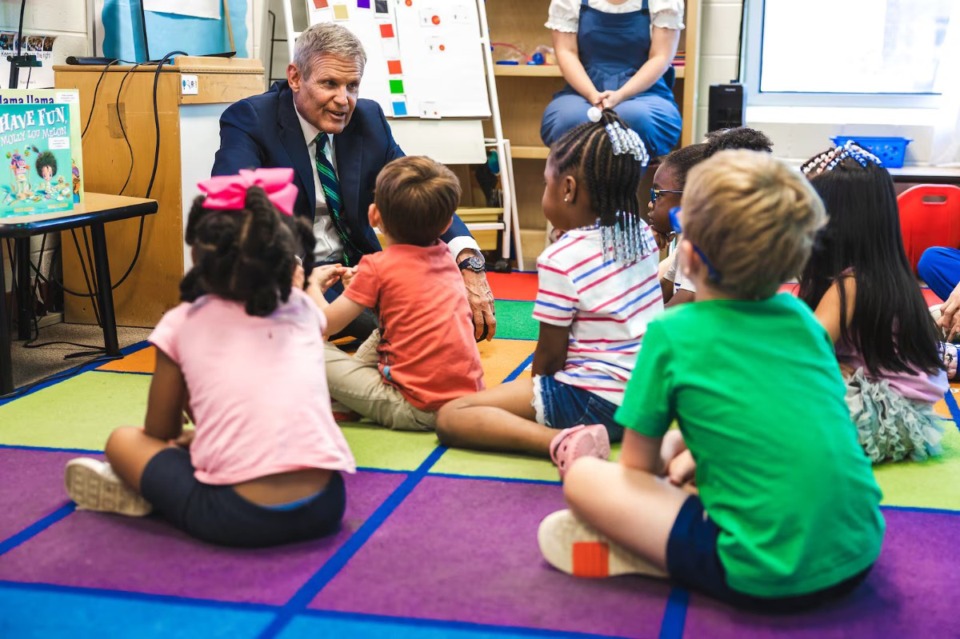 <strong>Gov. Bill Lee talks with students attending a summer learning program at Battle Academy, a public school in Chattanooga, Tennessee, on June 18, 2024. His revised universal private school voucher proposal, which stalled in the state legislature in 2024, will go before lawmakers again in 2025.</strong> (Courtesy of the State of Tennessee)