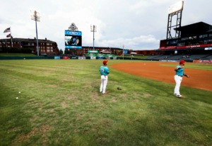 <strong>Memphis Redbirds players warm up on the patchy AutoZone Park field Thursday, Aug. 22. The field will be replaced before Memphis 901 FC&rsquo;s next home game Sept. 7.</strong> (Mark Weber/Daily Memphian)