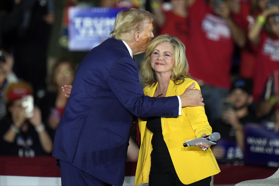 <strong>Then-nominee former President Donald Trump greets Sen. Marsha Blackburn, R-Tenn., as he arrives for a town hall event at Macomb Community College Friday, Sept. 27, in Warren, Mich.</strong> (Paul Sancya/AP file)