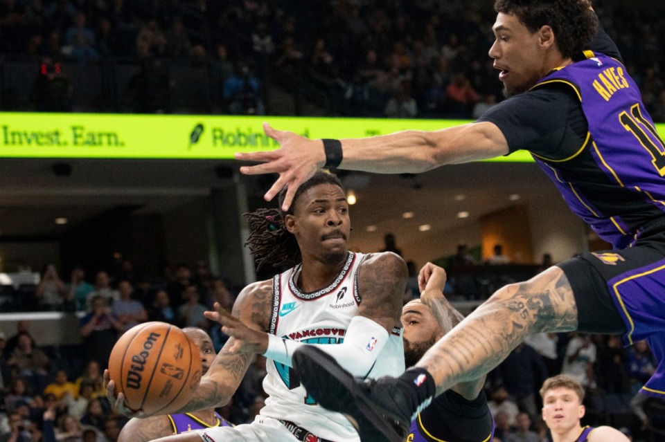 <strong>Memphis Grizzlies guard Ja Morant (12) looks to pass against Los Angeles Lakers center Jaxson Hayes (11) on Wednesday, Nov. 6, 2024.</strong> (Nikki Boertman/AP)