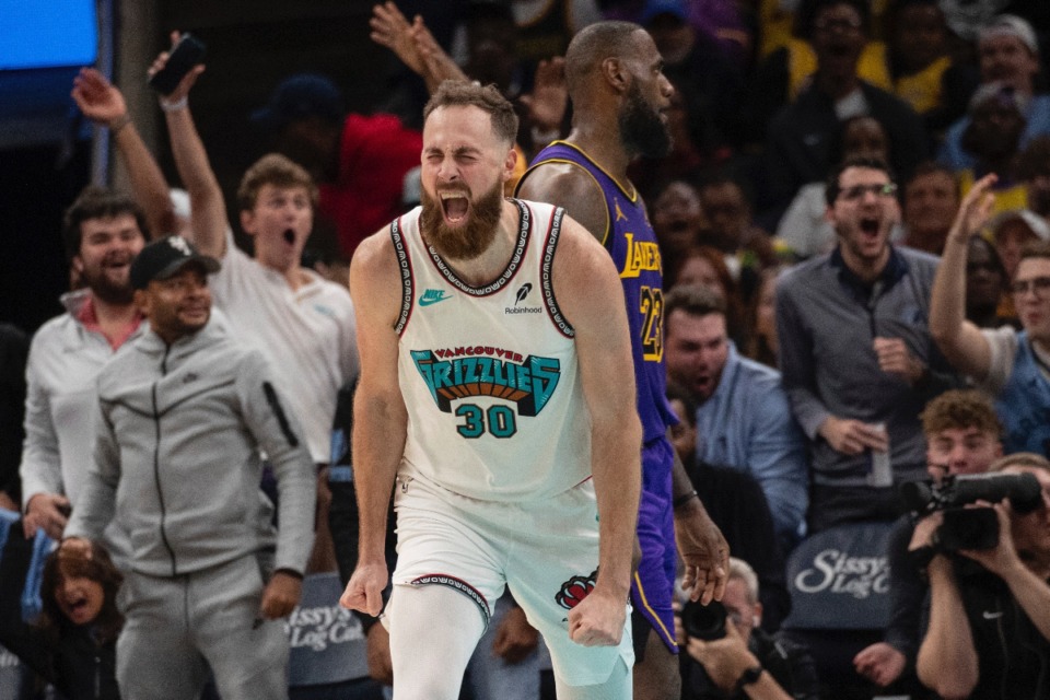 <strong>Memphis Grizzlies center Jay Huff (30) reacts after scoring as Los Angeles Lakers forward LeBron James (23) looks on during in the second half of an NBA basketball game Wednesday, Nov. 6, 2024, in Memphis, Tenn.</strong> (AP Photo/Nikki Boertman)