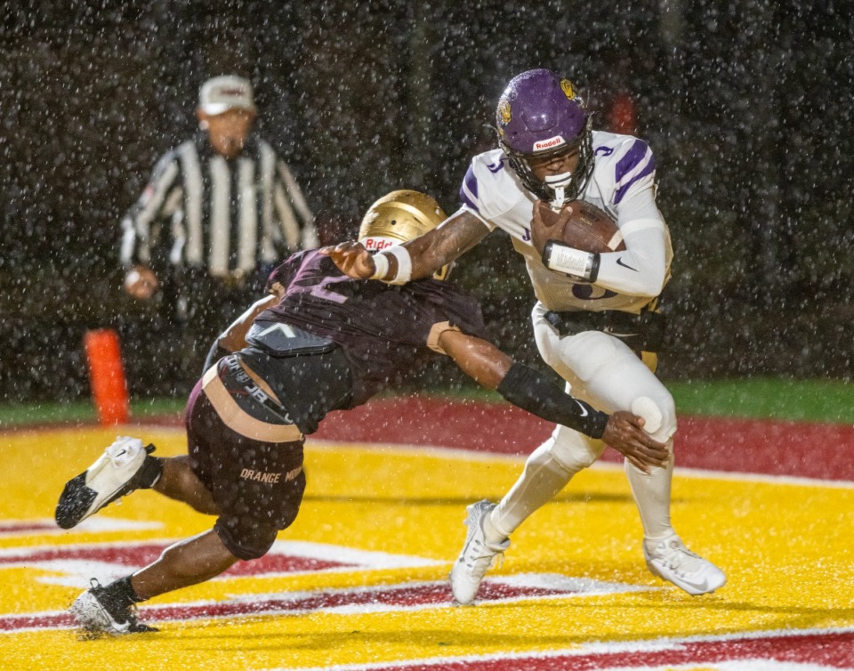 <strong>Southwind quarterback Kelvin Perkins breaks a tackle from Melrose's Jamarion Morrow in the endzone to escape a safety. Southwind pulls off the victory 8-6 over a tough Melrose.</strong> (Greg Campbell/Special for The Daily Memphian file)