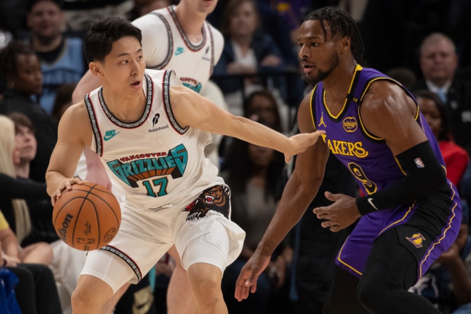 <strong>Los Angeles Lakers guard Bronny James (9) defends Memphis Grizzlies guard Yuki Kawamura (17), of Japan, in the second half of an NBA basketball game Wednesday, Nov. 6, 2024, in Memphis, Tenn.</strong> (AP Photo/Nikki Boertman)