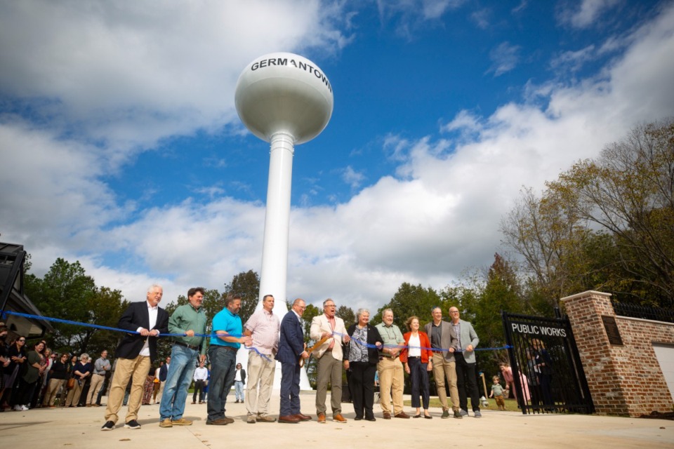 <strong>From left, Patrick Lawton, Scott Sanders, Brian Ueleke, Jon McCreery, Bo Mills, Mike Palazzolo, Mary Anne Gibson, Rocky Janda, Sherrie Hicks, Forrest Owens and Jason Huisman celebrate Germantown&rsquo;s new water tower.</strong> (Ziggy Mack/Special to The Daily Memphian)