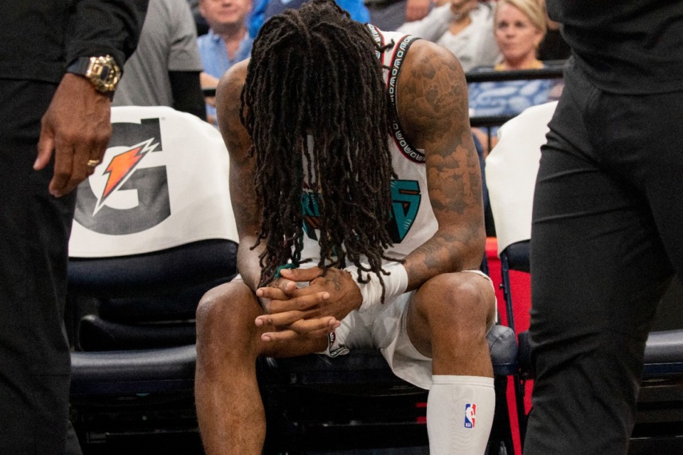 <strong>Memphis Grizzlies guard Ja Morant (12) sits on the bench after leaving the game with an injury in the second half of an NBA basketball game against the Los Angeles Lakers Wednesday, Nov. 6, at FedExForum.</strong> (Nikki Boertman/AP file)