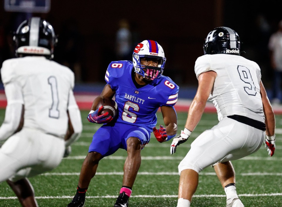 <strong>Bartlett running back Geron Johnson (middle) looks for a running lane against Houston on Friday, Oct. 4, 2024. The Panthers and the Mustangs will play again in the second round of the playoffs on Friday, Nov. 15, 2024.</strong>&nbsp;(Mark Weber/The Daily Memphian file)