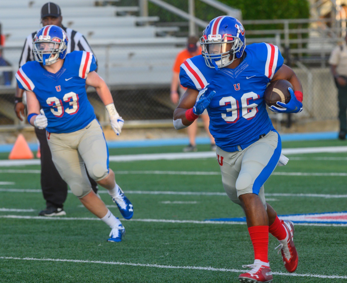 <strong>MUS tight end Darius Brown scores on the very first play after his interception in the MUS-Ridgeway High School season opener Friday night, Aug. 23, at MUS.</strong> (Greg Campbell/Special to the Daily Memphian)