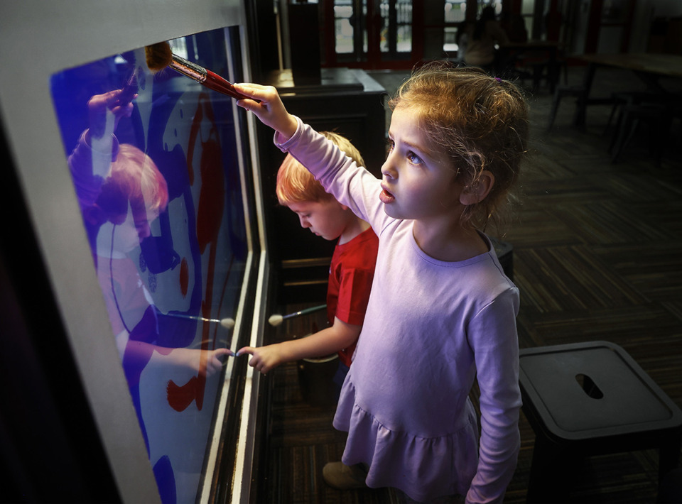 <strong>Annie Starnes, 4, and her brother Watson Starnes, 2, play on a new digital-painting experience at the Children's Museum of Memphis on Friday, Nov. 8.</strong> (Mark Weber/The Daily Memphian)