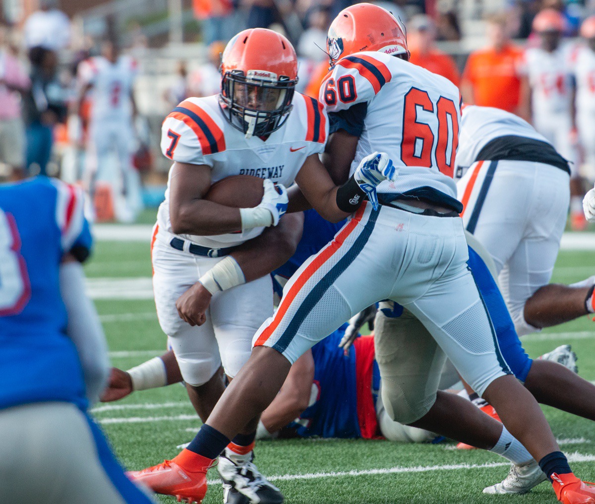 <strong>Ridgeway running back Brandon Goodwin fights through the line as teammate Dearrius Majors helps block MUS defenders during Friday night's game at MUS.</strong> (Greg Campbell/Special to the Daily Memphian)